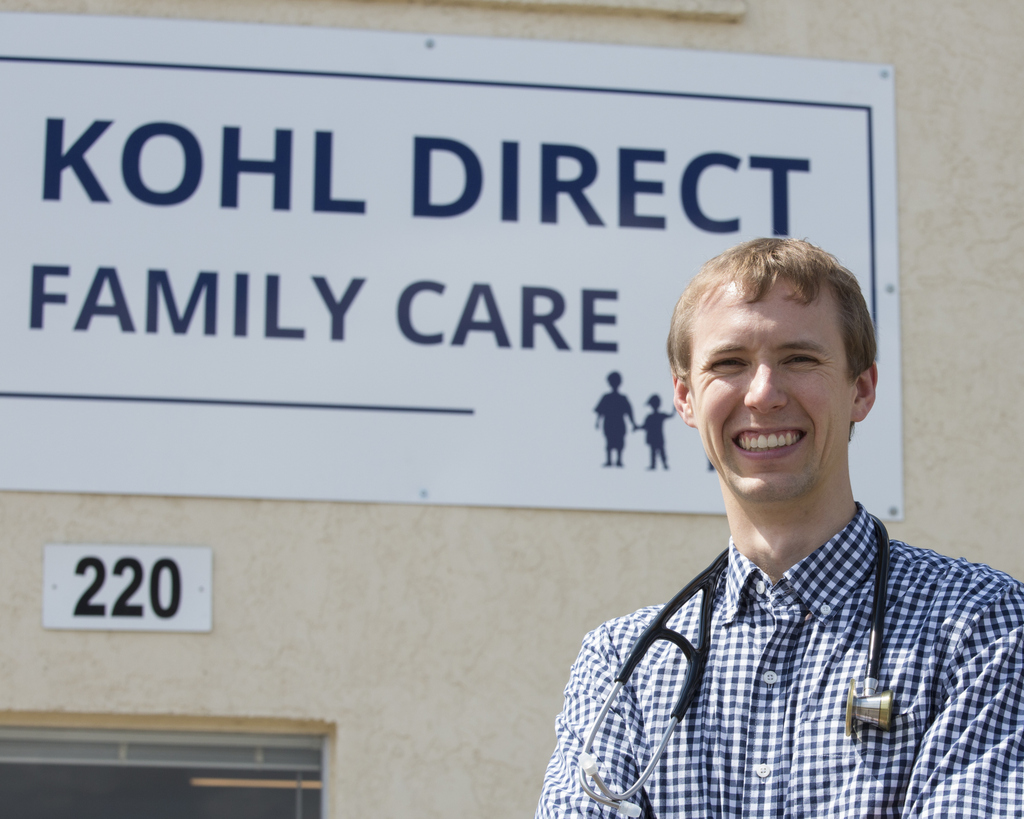 Dr. Daniel Kohl in front of the Kohl Direct Family Care clinic sign
